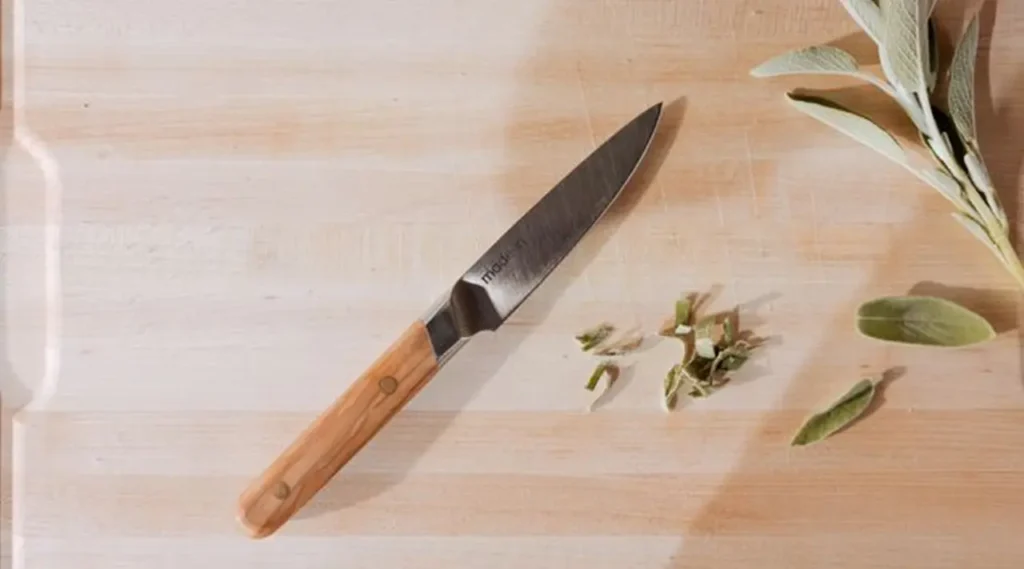 Pairing knife on a chopping board